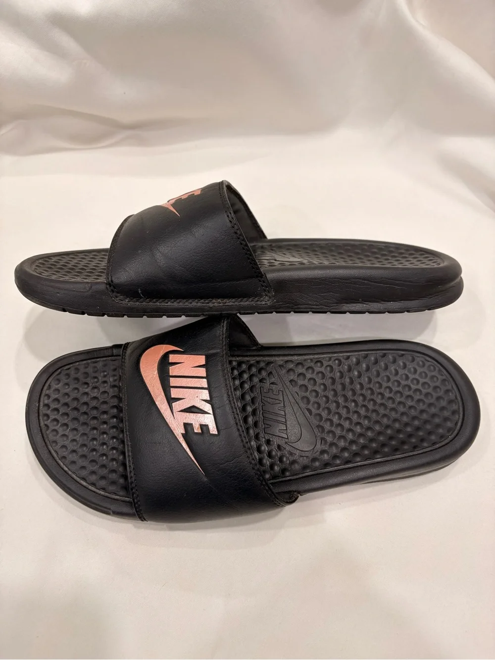 Woman’s Nike Benassi Black and Rose Gold Slides Size 7